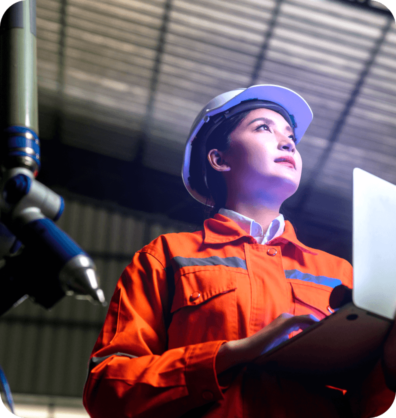 Woman in safety gear working on an industrial site